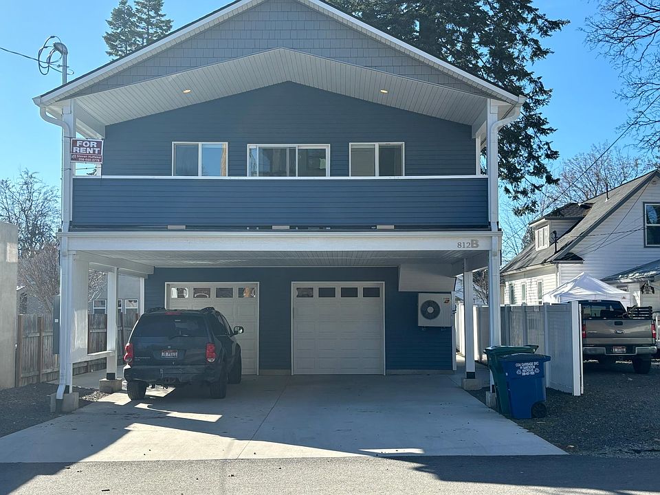 Upper unit with covered parking and secured heated 1 car garage