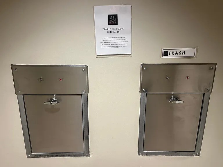 Recycling and trash chutes on the 10th floor near the Unit.