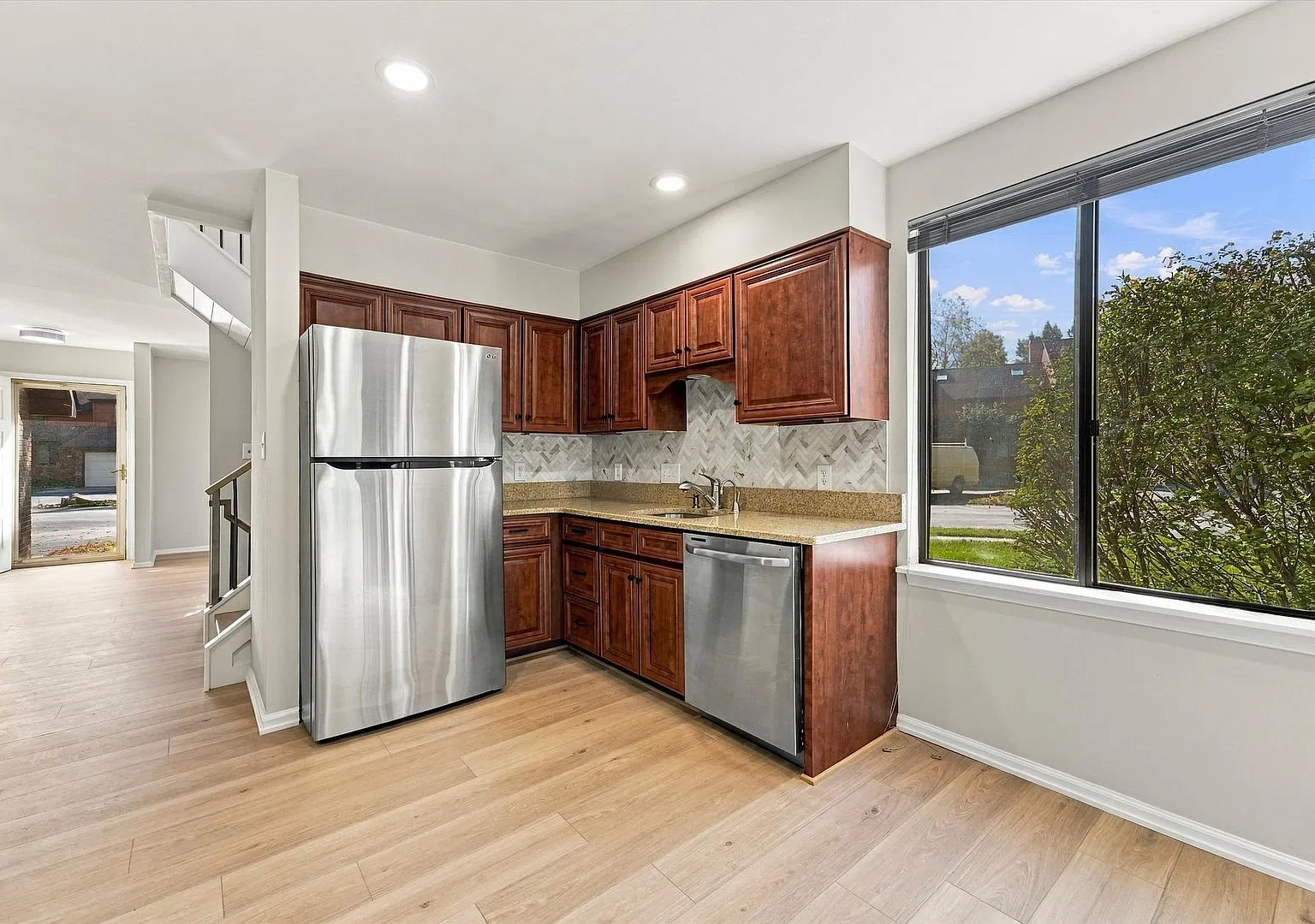 Beautifully Renovated End-Unit Townhome with Finished Basement, Deck & Garage | 300 Winding Way — Photo 4