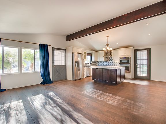 Entry, open living room, kitchen and dining room