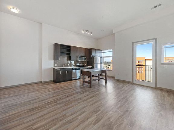 Large spacious living room with luxury vinyl plank flooring