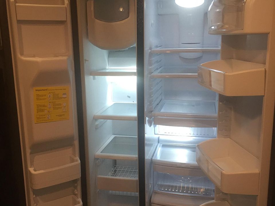 Inside of new fridge, its heavy duty and ice maker already f
