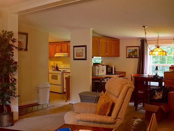 view of family room, kitchen, dining from entry
