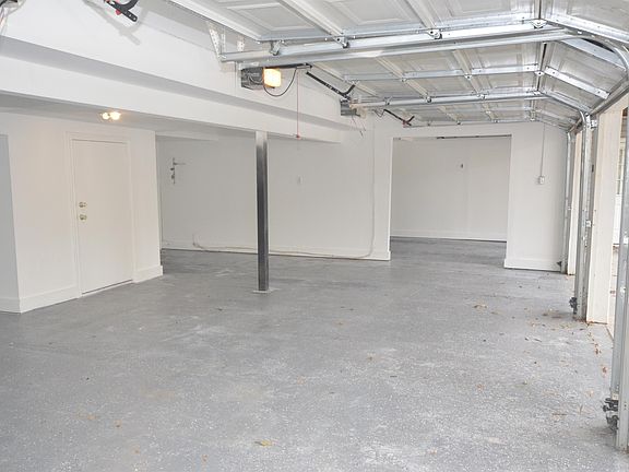 Large 4 Car Garage, each with it's own door and individual opener.