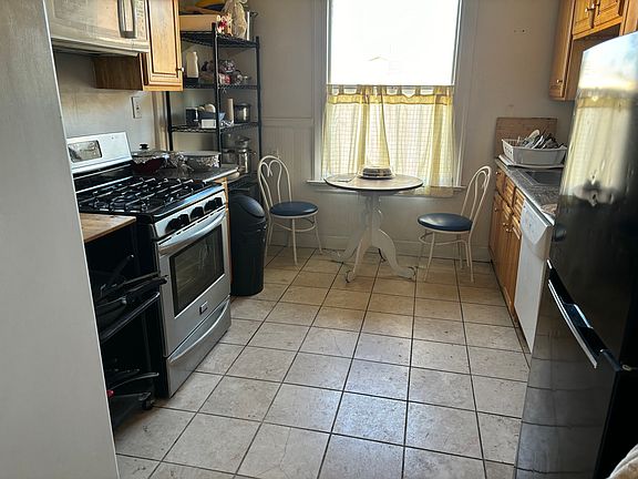 Kitchen with Gas Stove, Dishwasher, Microwave and large Refrigerator