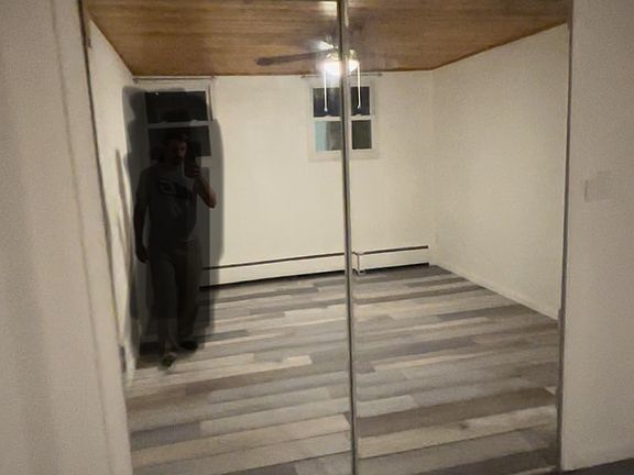 1 Bedroom with roomy mirrored closet and new flooring.