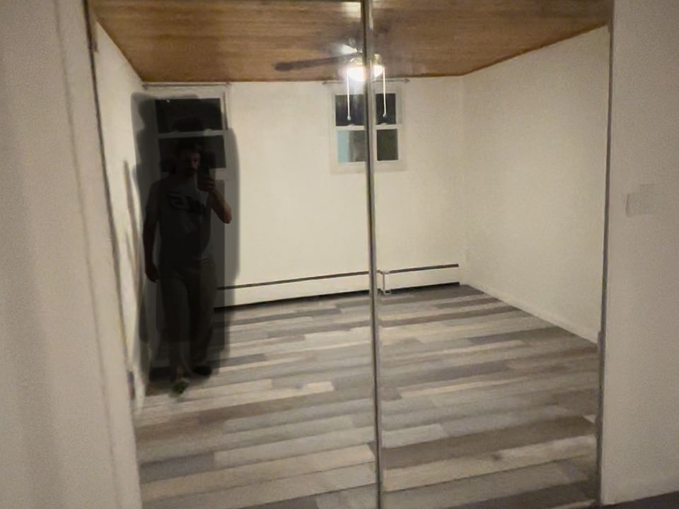 1 Bedroom with roomy mirrored closet and new flooring.