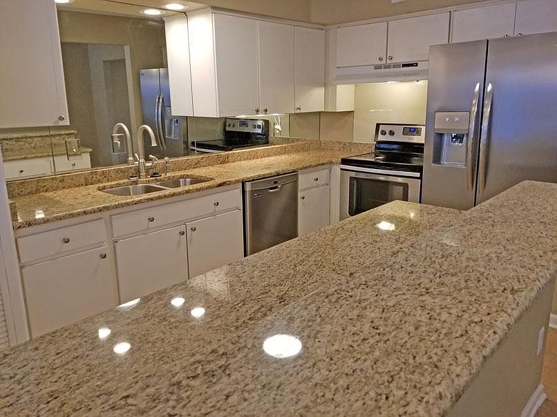 Updated Kitchen with Granite, Stainless Steel Appliances, and Breakfast Bar