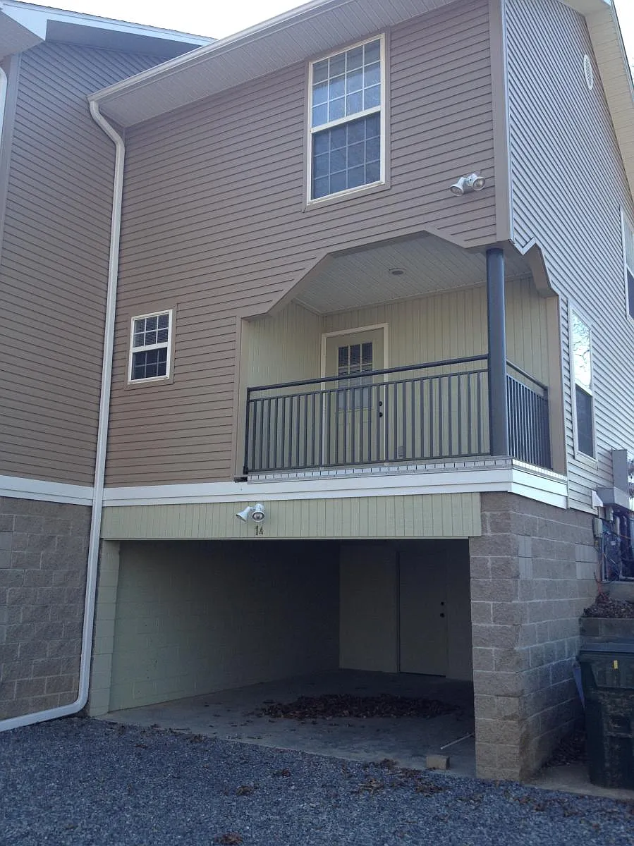 Carport entry with security lights. - 1401 Diuguid Dr #1A