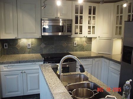 Kitchen (granite coutners, slate floor, track lites S/S appliances)