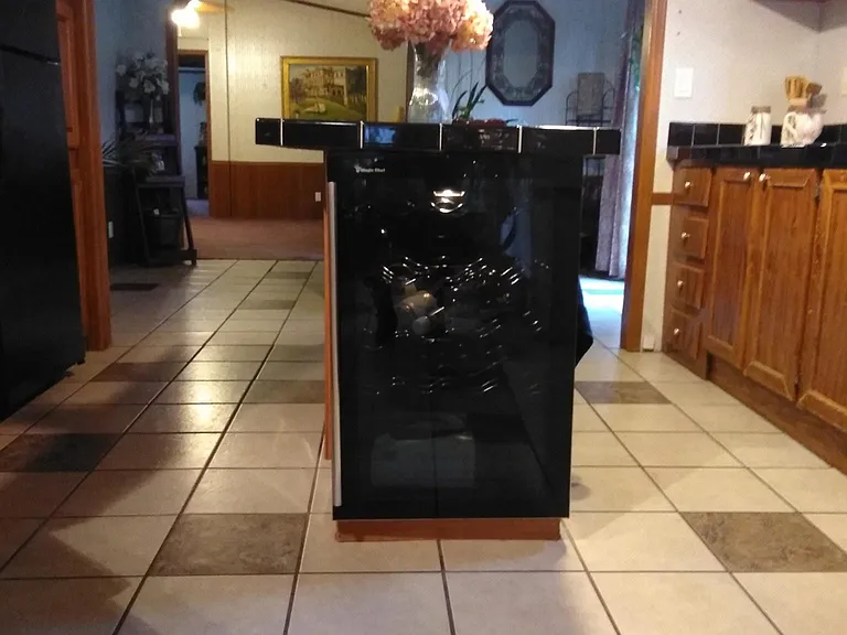 Kitchen includes wine refrigerator