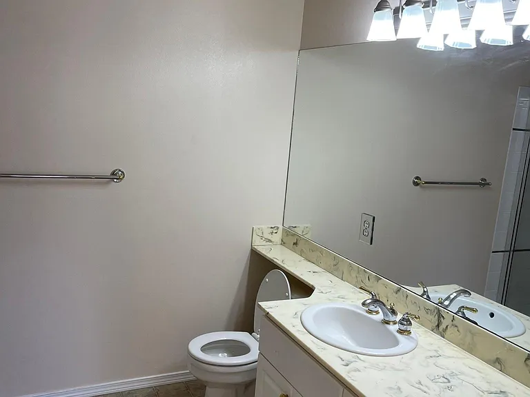 Master bathroom with full length mirror and 2 basin sinks