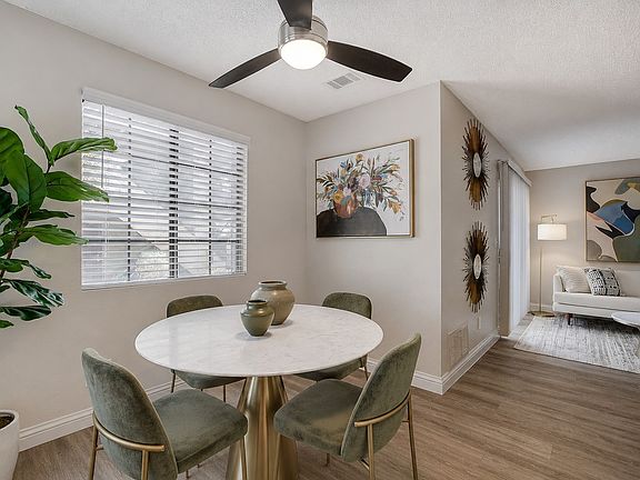 Elevate your living at Shelter Cove with this stylish dining area featuring a chic round table and modern decor. Enjoy natural light through oversized windows and a spacious layout perfect for gatherings. Schedule your tour today!