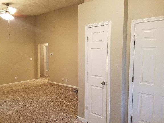 Entry closet and door to two-car garage