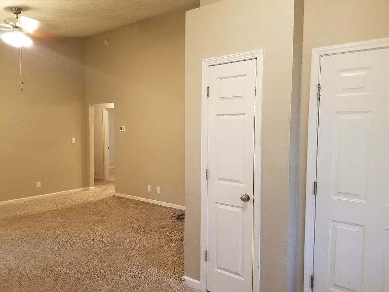 Entry closet and door to two-car garage