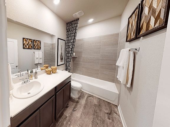 Family or guests can enjoy this luxurious secondary bathroom.