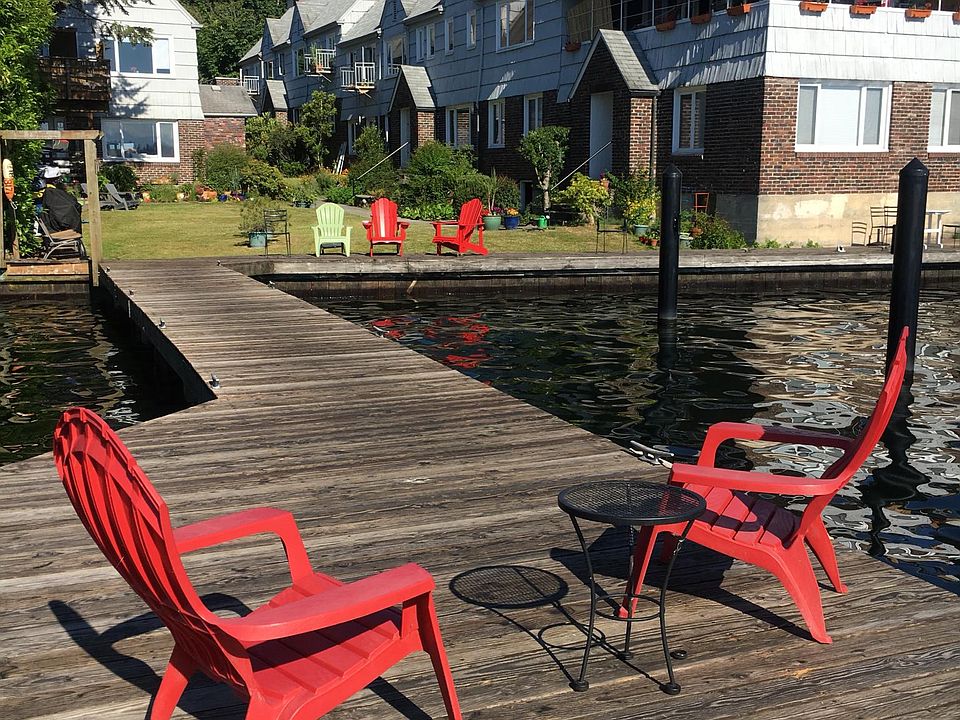 Private Dock with dock with moorage and grass courtyard