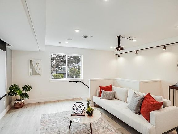 Movie theater with steps to basement & yard.