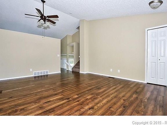 Living-room with coat closet and a space that could be used as a formal dining-r