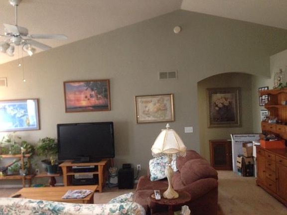 Family room from kitchen (master BR entry through arched ope
