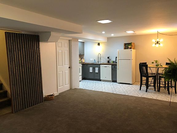 Open concept kitchen and living room with in-kitchen eating space.