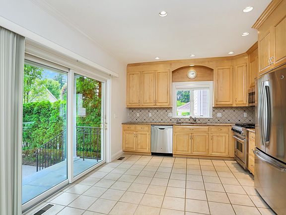 Spacious Gourmet Kitchen w/Sliders to Private Patio and Fenced-in Backyard