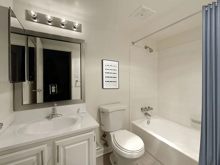 Finish Package II bathroom with white cabinetry and countertop
