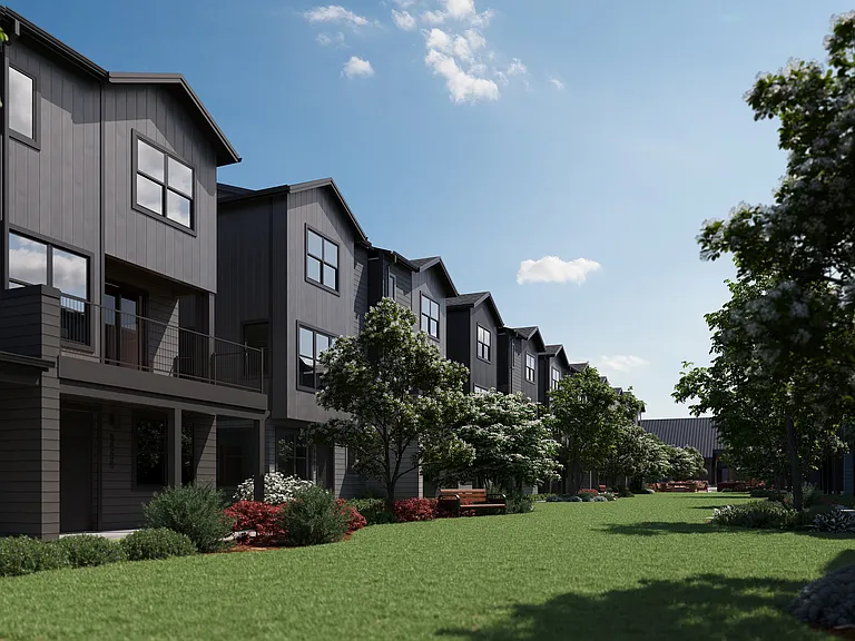 Oxenfree Clear Creek townhomes lining the amenity lawn.
