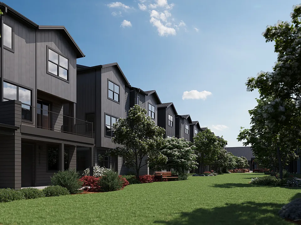 Oxenfree Clear Creek townhomes lining the amenity lawn.