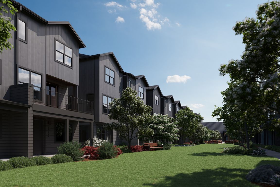 Oxenfree Clear Creek townhomes lining the amenity lawn.