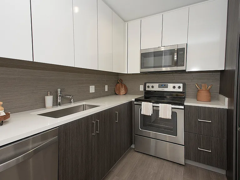 Chef-inspired kitchen with quartz countertops, modern fixtures, and stainless-steel appliances.