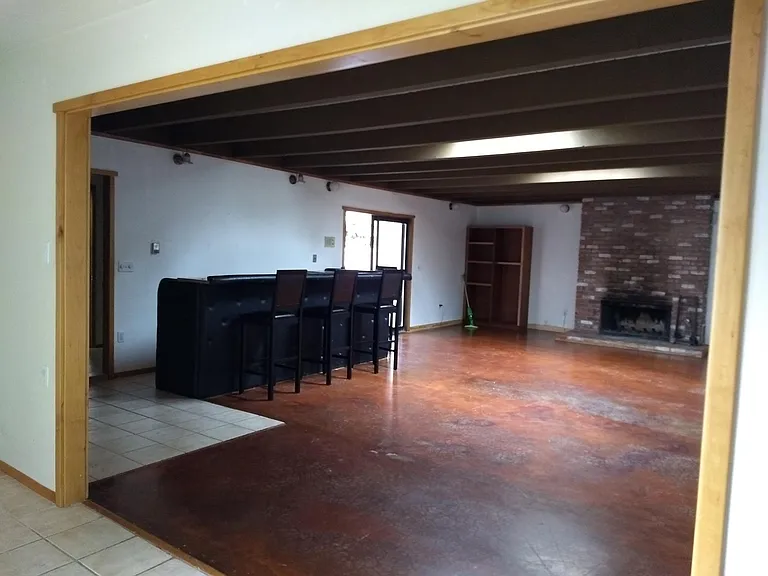 Huge recreation room with wet bar, sink, mini fridge area and separate entrance