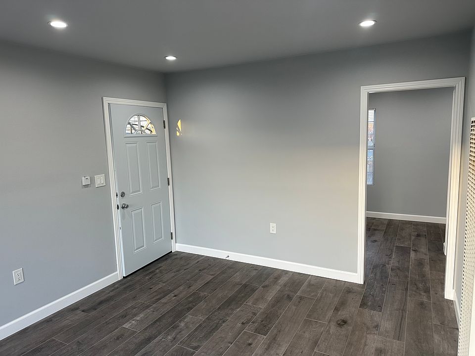 The apartment has been completely renovated. The living room has new doors, recess lights, base mouldings as well as door casings . It also has new paint and new ceramic wood planks tiles that match the wall color.