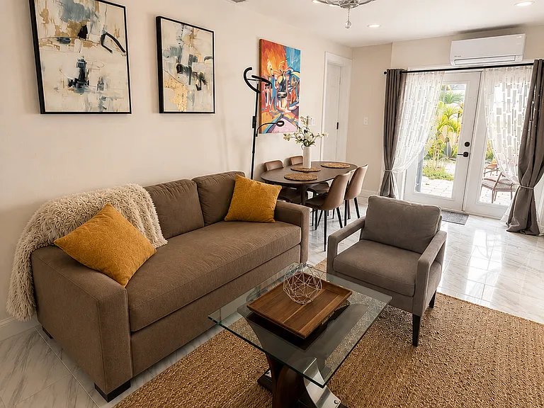 Private guest suite living area with queen high-end sleeper sofa, smart TV, kitchenette access, and extra privacy for in-laws, couples, older kids, or colleagues.