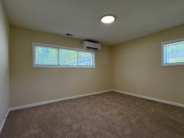 View of Primary Bedroom w/ Mini-Split Heat Pump