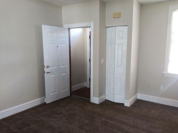 Coat closet next to front double door entry with small vestibule.