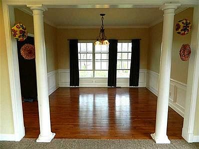 Dining Room. Dining room as viewed from the LR. Back windows overlook fields and woods. Beautiful hardwood floor.