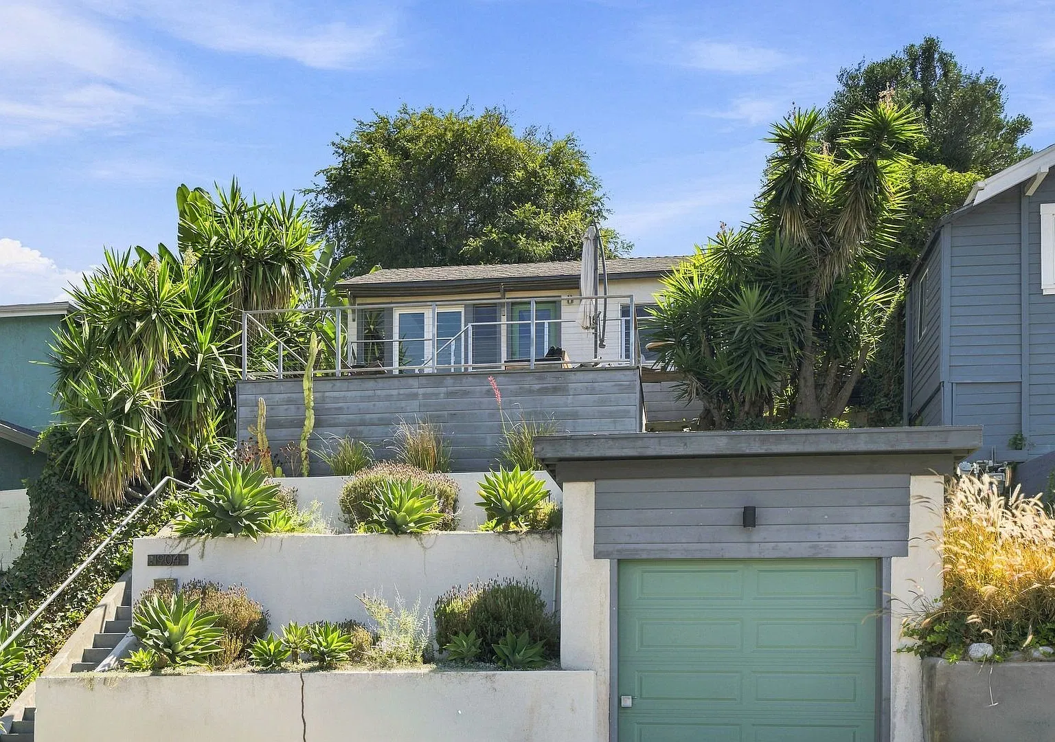 Charming Hillside Retreat with Modern Upgrades, Stunning City Views & Expansive Outdoor Living! — Photo 1