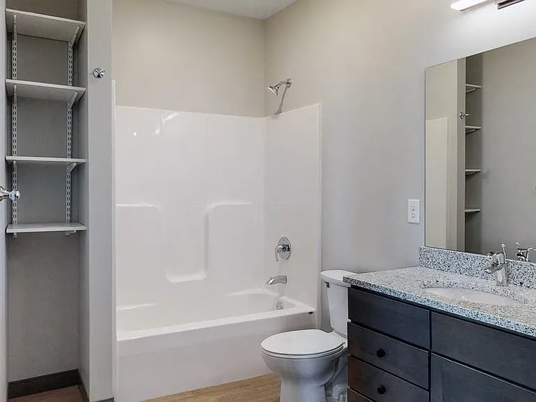 Our bathrooms include spacious vanities with ample storage.