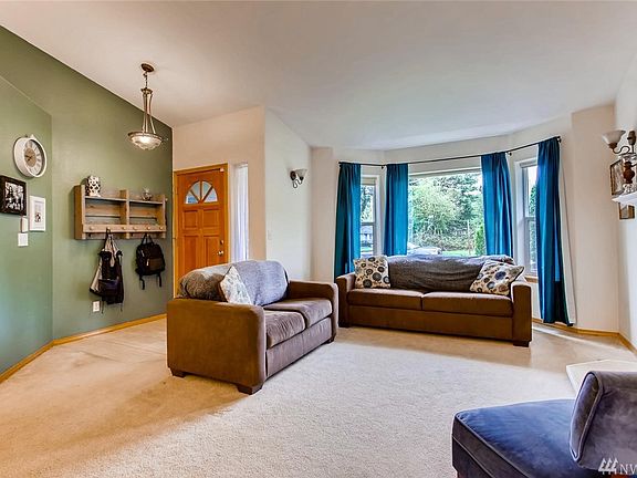 As you enter your new home the first thing you will notice is how light and open it is.  This is the view from the dining area looking toward your front door and the bay window.