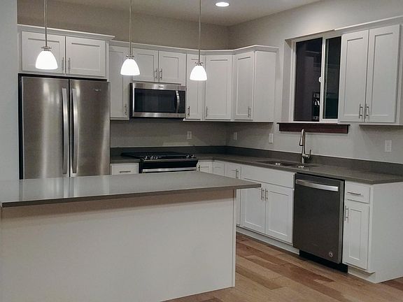 Kitchen with Quartz Countertops and Gas Stove