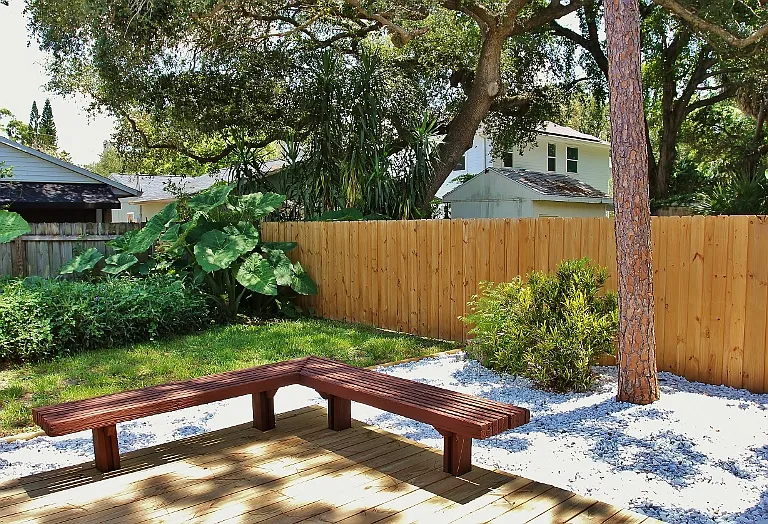 Gorgeous Backyard Deck With Built-in Seating. Perfect For Your Backyard Activities.