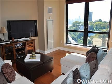 Living room with Hudson River and NYC views