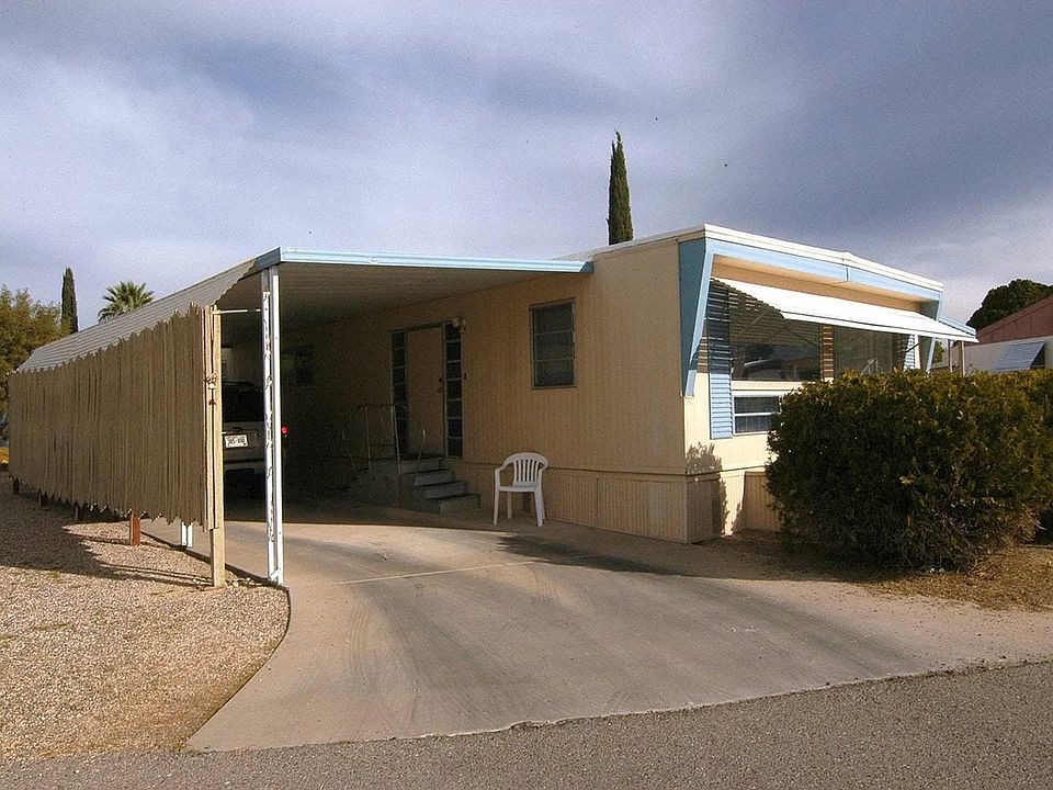 Front view with a covered two-car parking space