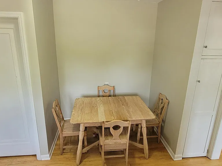 Past tenants have moved the refrigerator to this nook and surrounded it with shelving and countertop