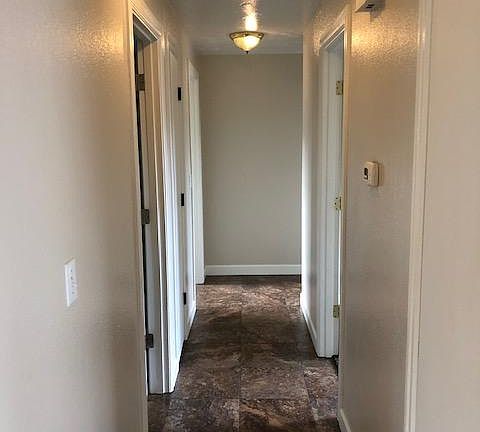 turning right down the hallway. The first door on the right and the second door on the left are linen closets