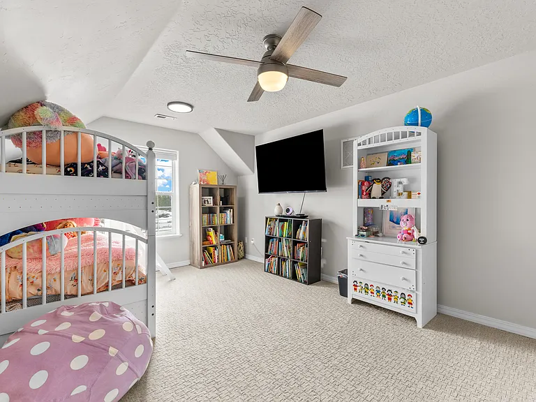 Upstairs bonus room. Being used in this photo a 4th bedroom.