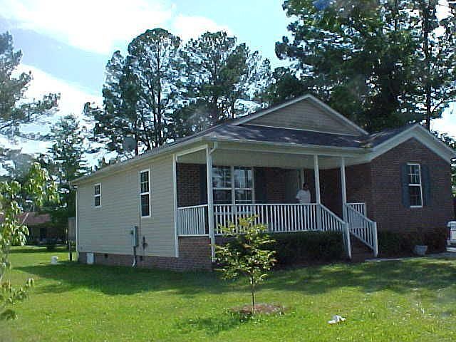 The ront is brick and the rear and sides are vinyl