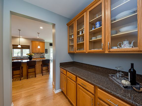 A butler pantry located between the kitchen and dining room for easy serving while you entertain gue