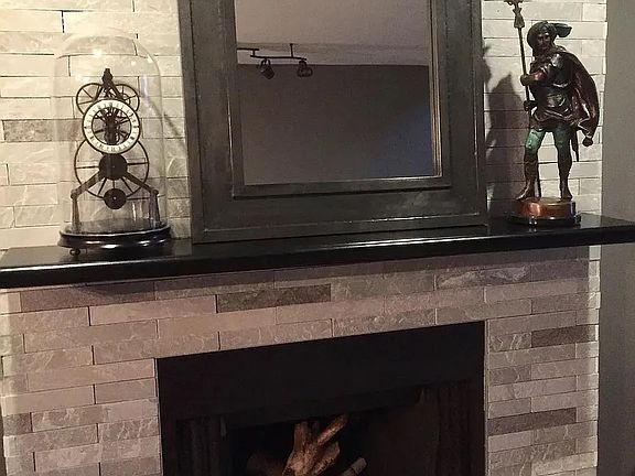 Fireplace in living room space.